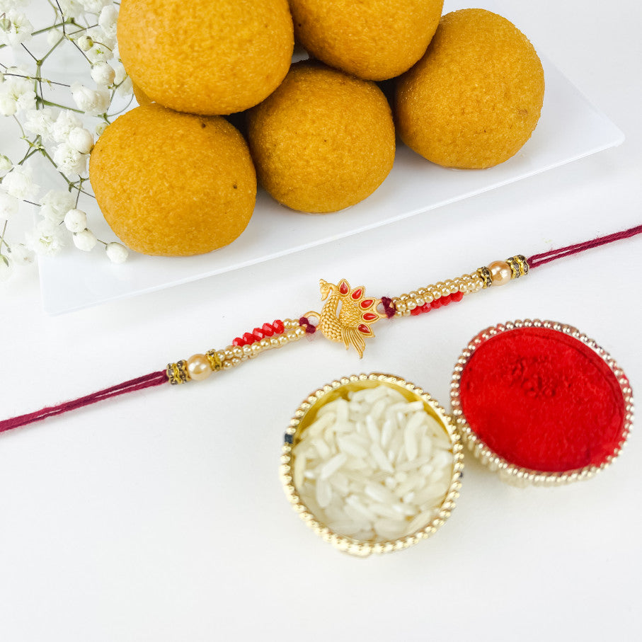 Golden Peacock Rakhi With Ladoo